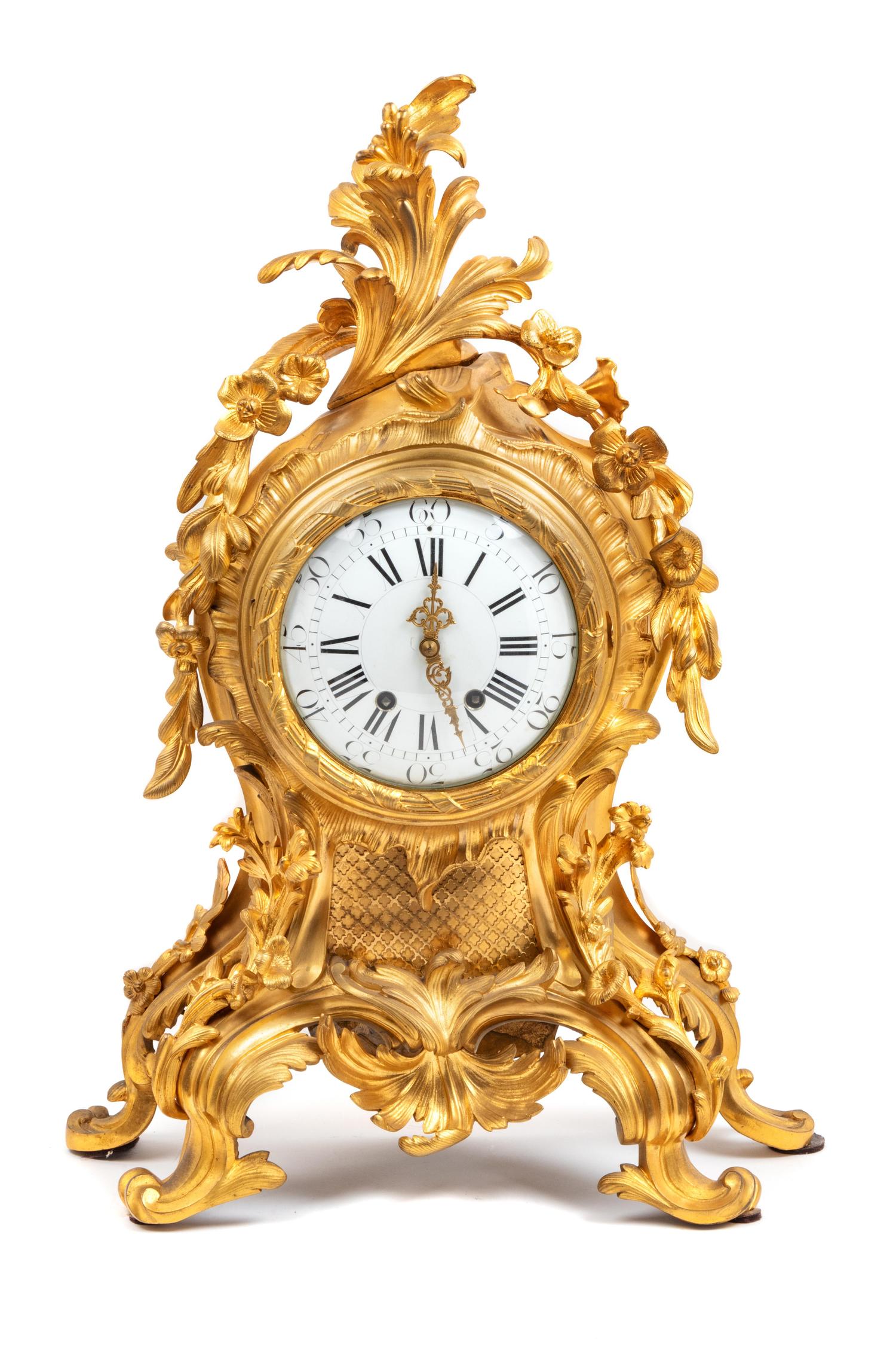 A Louis XV Style Gilt Bronze Three-Piece Clock Garniture