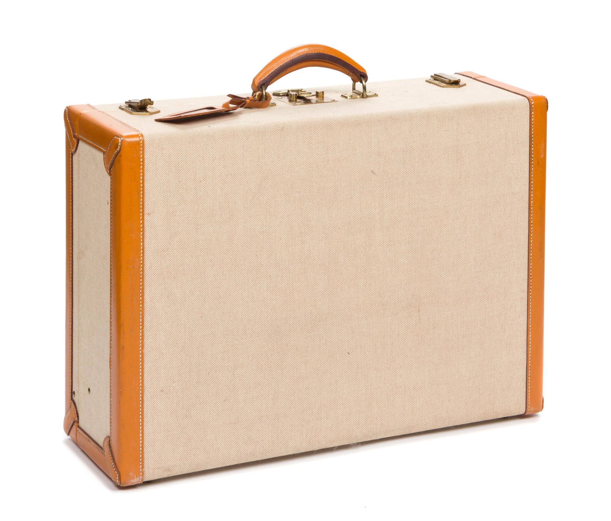 An Hermes Leather Banded Canvas Suitcase, 21.5" x 15" x 7".