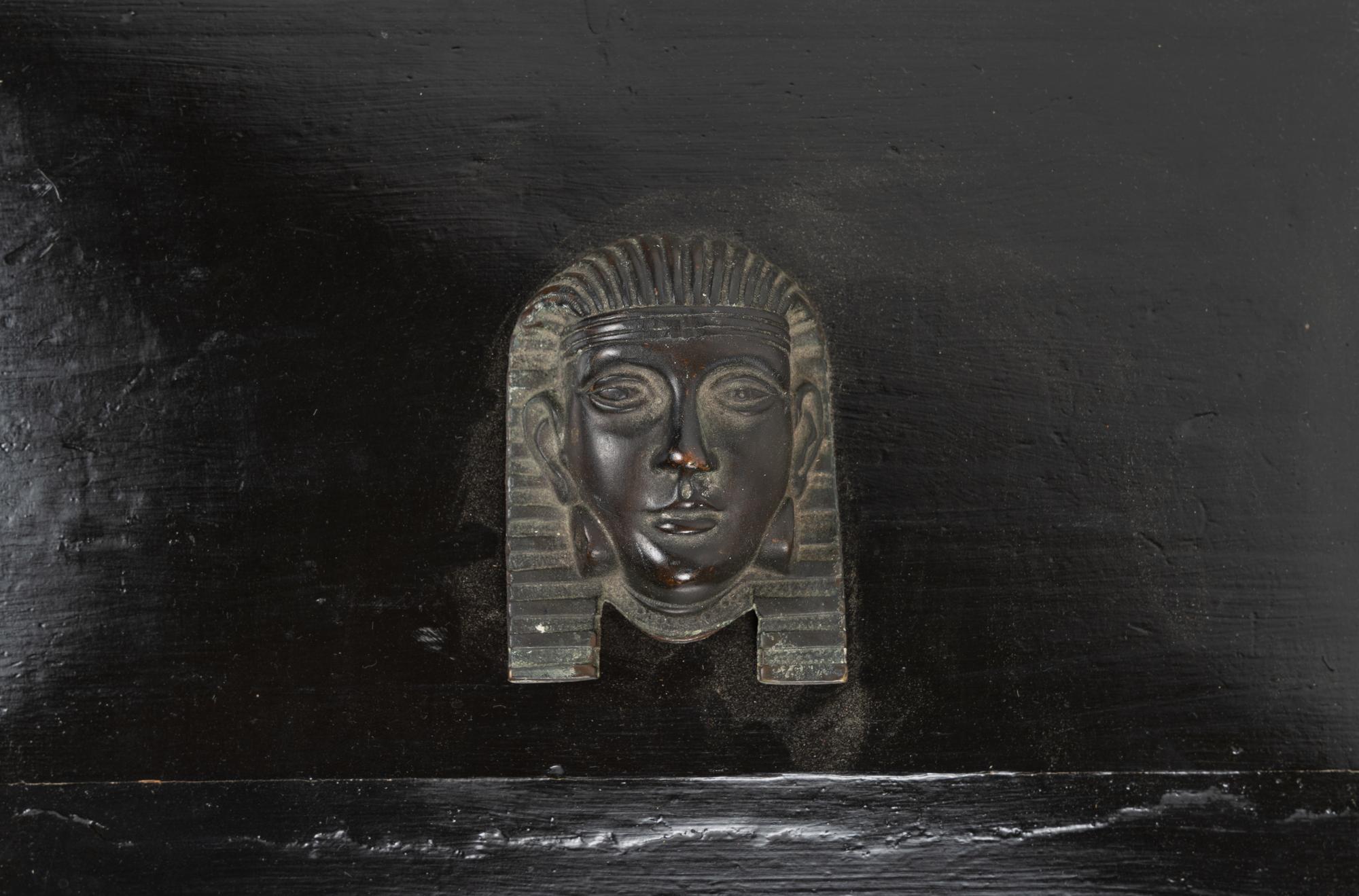 An Egyptian Revival Ebonized Coal Hod