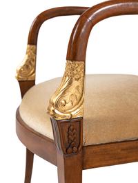 A Set of Four Baltic Style Parcel Gilt Walnut Armchairs