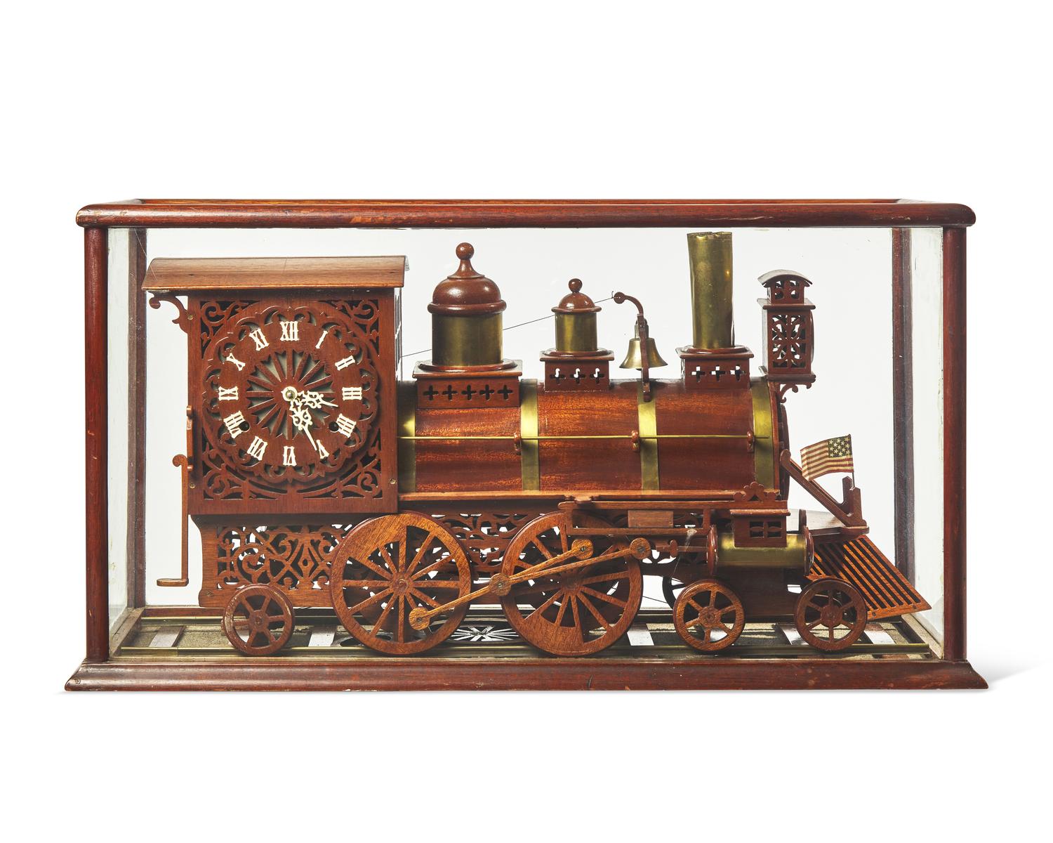 A brass-fitted mahogany 1886 steam locomotive / train fitted with clock, made by R. Davidson, April 10, 1910, works by Waterbury Clock Co.