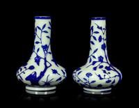 A Pair of Chinese Blue Overlay Opaque White Glass Bottle Vases