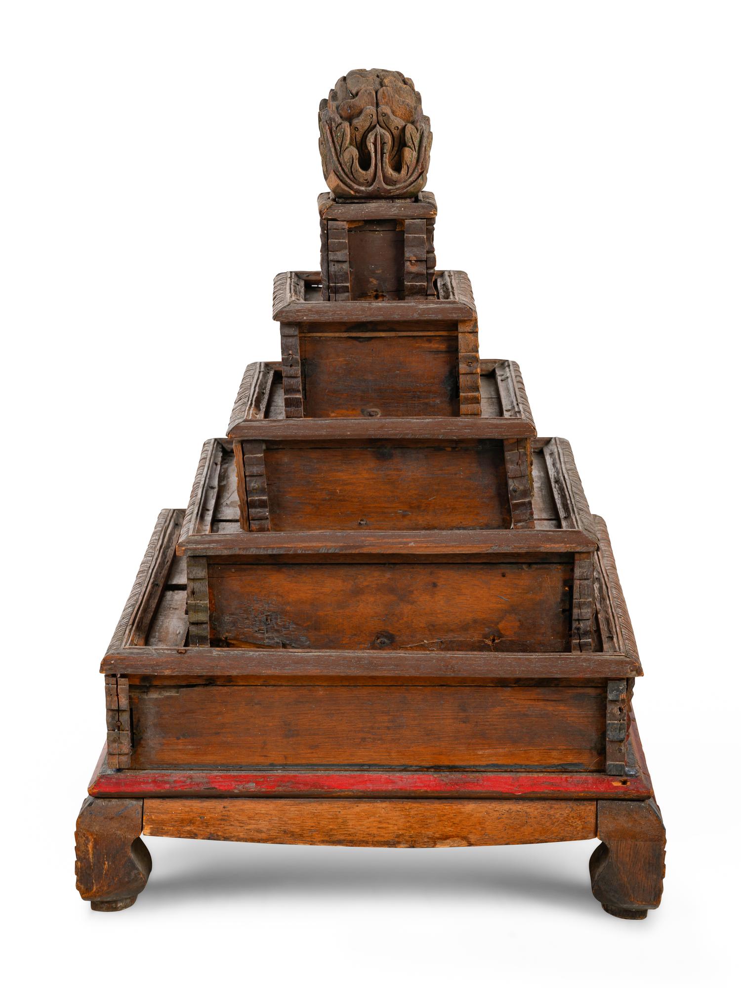 A Mongolian Gilt and Red Lacquered Carved Wood Stand