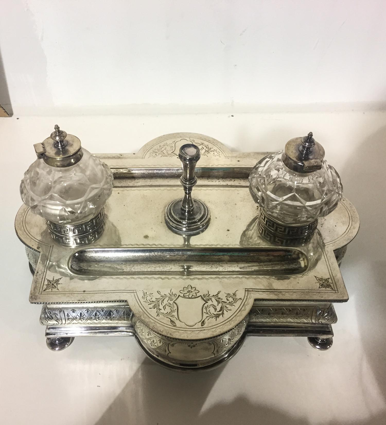 A Victorian Silver-Plate Standish, Probably Parkin & Marshall, Sheffield, with cut glass ink pots and bright cut vines issuing from vac