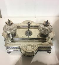 A Victorian Silver-Plate Standish, Probably Parkin & Marshall, Sheffield, with cut glass ink pots and bright cut vines issuing from vac