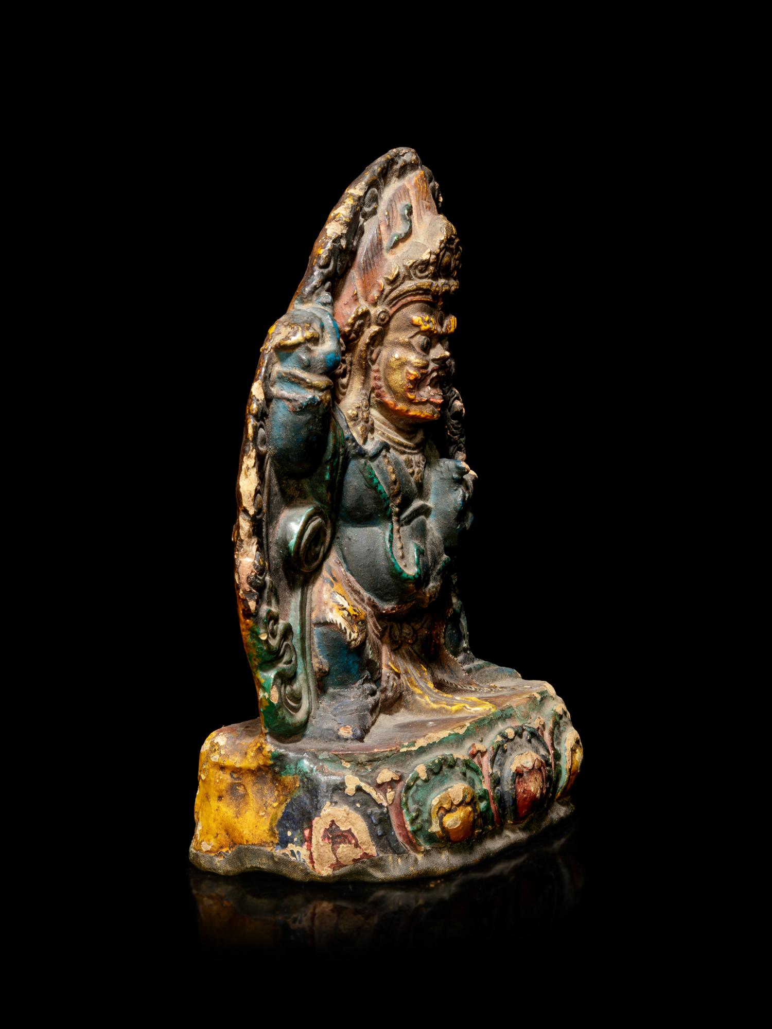 A Tibetan Polychrome Lacquered Figure
