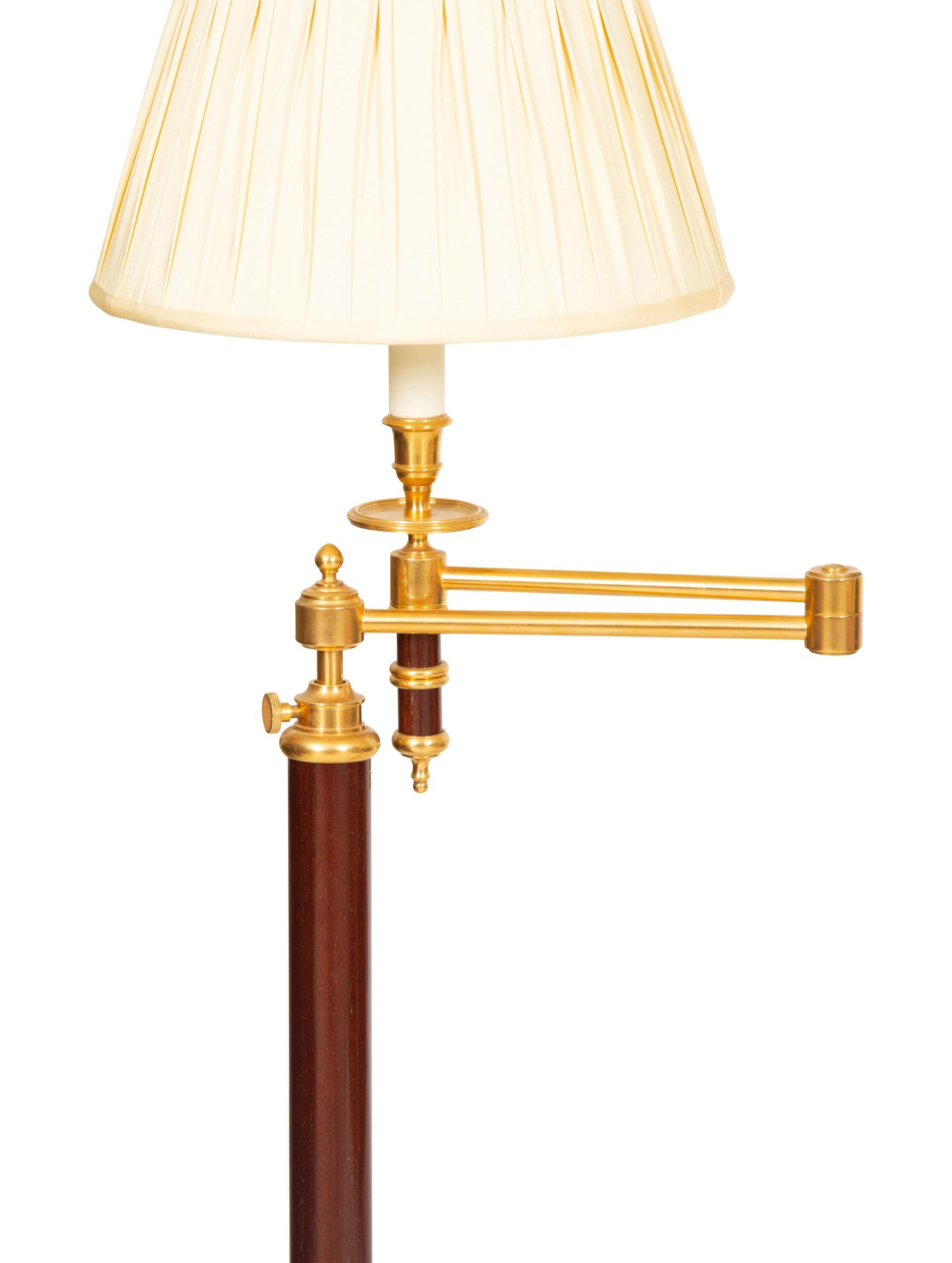A Group of Four Brass Adjustable Floor Lamps