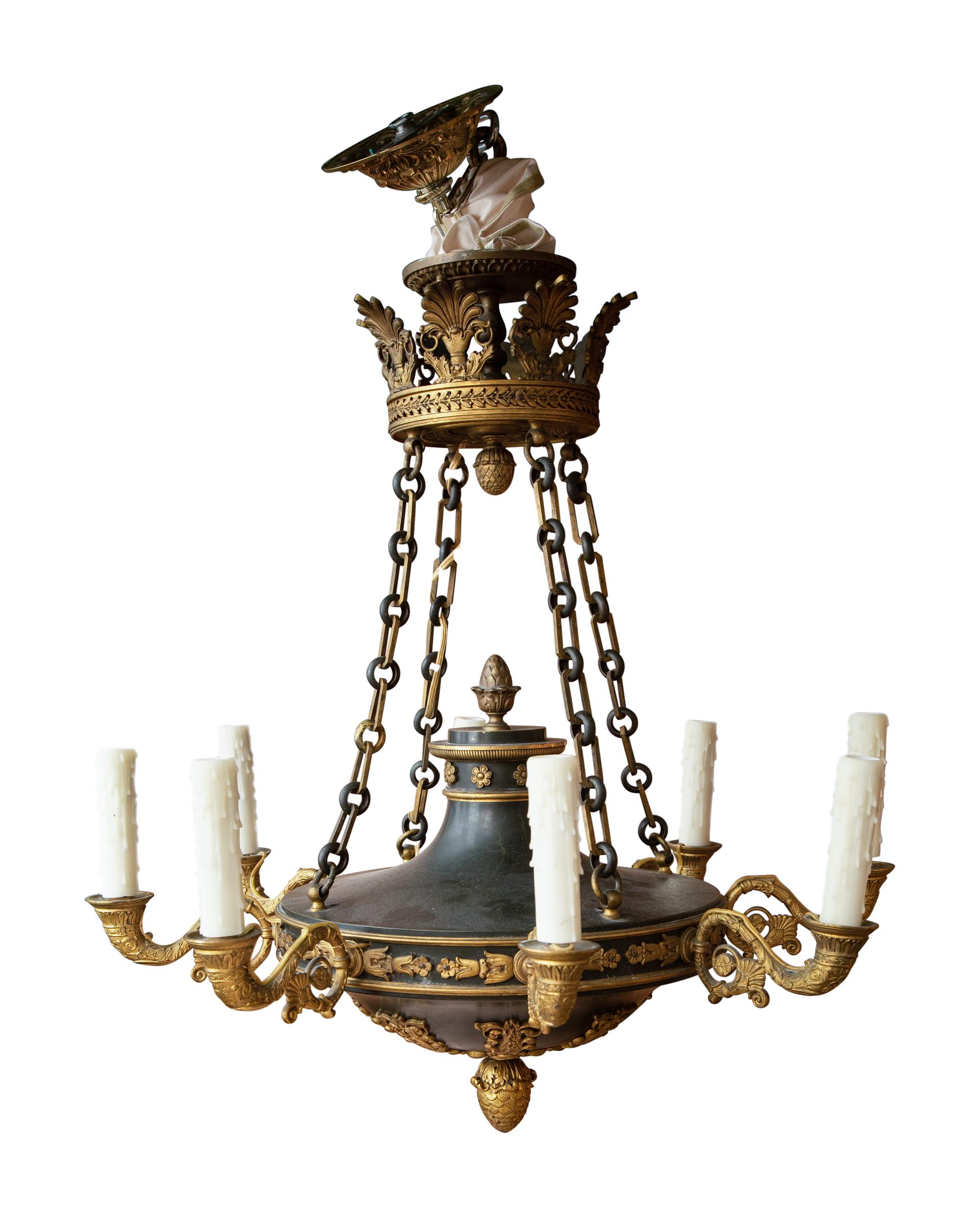 An Empire Style Patinated and Gilt Bronze Eight-Light Chandelier