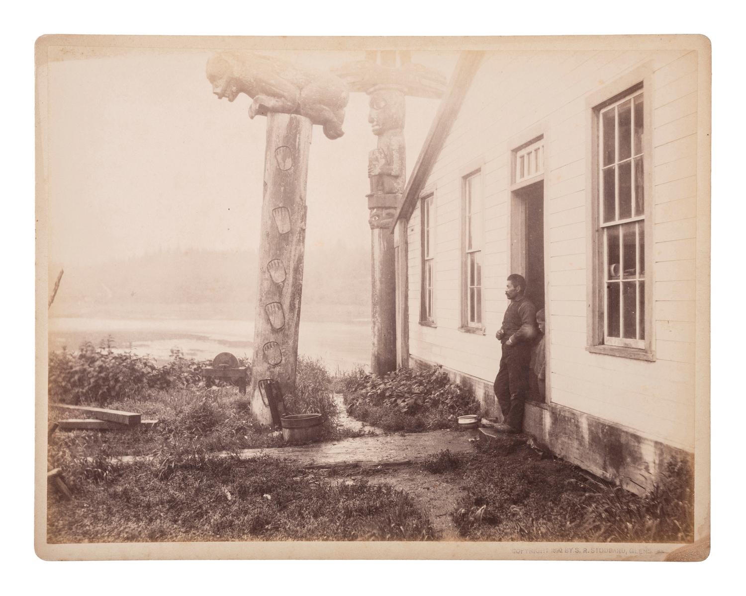 [NATIVE AMERICANS]. STODDARD, Seneca Ray (1844-1917), photographer. A group of 2 photographs of Tlingit Chief Shakes totem poles and home, Fort Wrangell, Alaska.