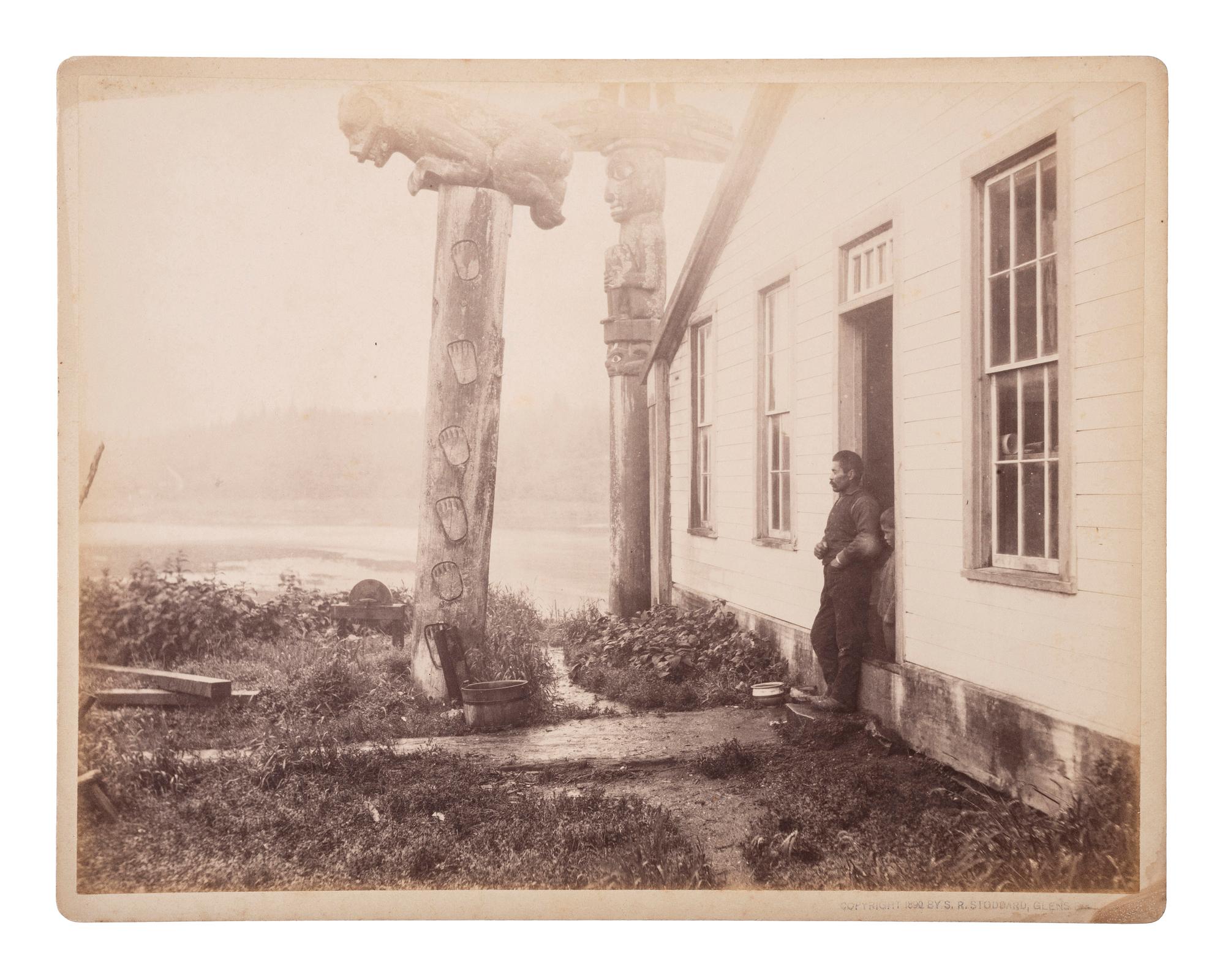 [NATIVE AMERICANS]. STODDARD, Seneca Ray (1844-1917), photographer. A group of 2 photographs of Tlingit Chief Shakes totem poles and home, Fort Wrangell, Alaska.