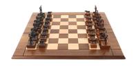 A Brown Patinated Metal "Range War" Chess Set, Leigh Aldrich, 1991 Height of tallest 3 inches.