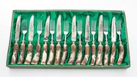 A Continental Steak Knife and Fork Service Length of knife 8 5/8 inches.