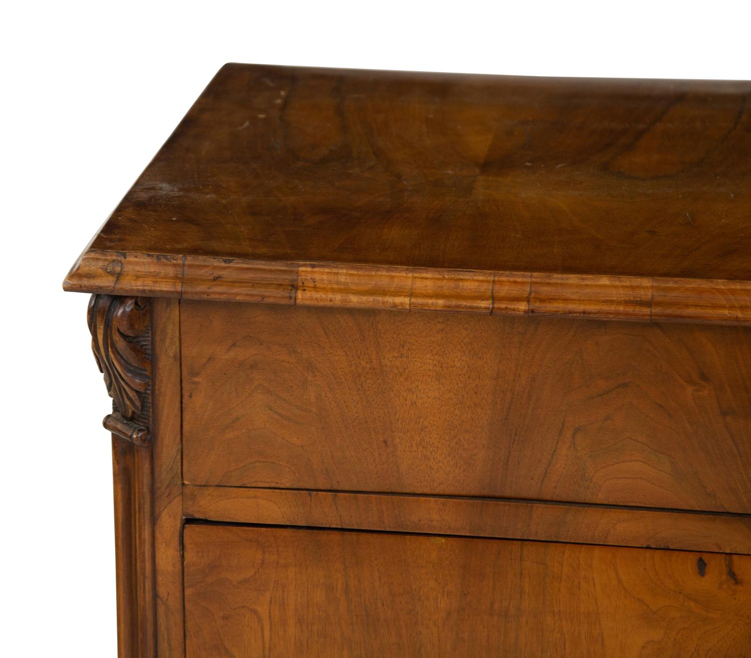 A Continental Walnut Chest of Drawers