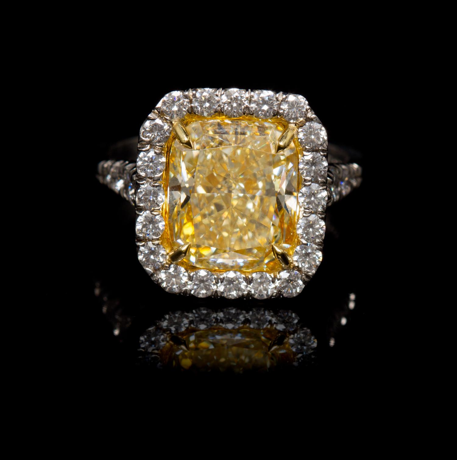 A Platinum, Yellow Gold, Fancy Intense Yellow Diamond and Diamond Ring, 5.60 dwts.