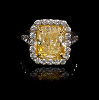 A Platinum, Yellow Gold, Fancy Intense Yellow Diamond and Diamond Ring, 5.60 dwts.
