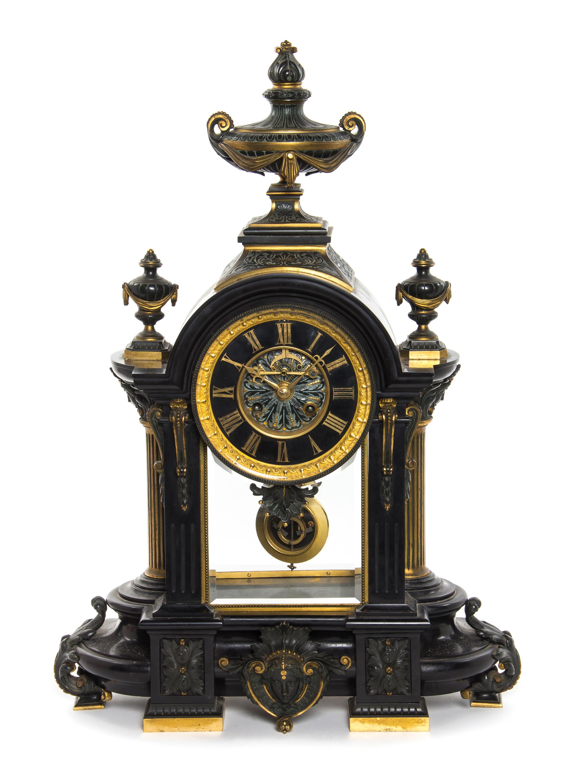 A French Neoclassical Ebonized Bronze and Slate Mantel Clock, Height 27 inches.
