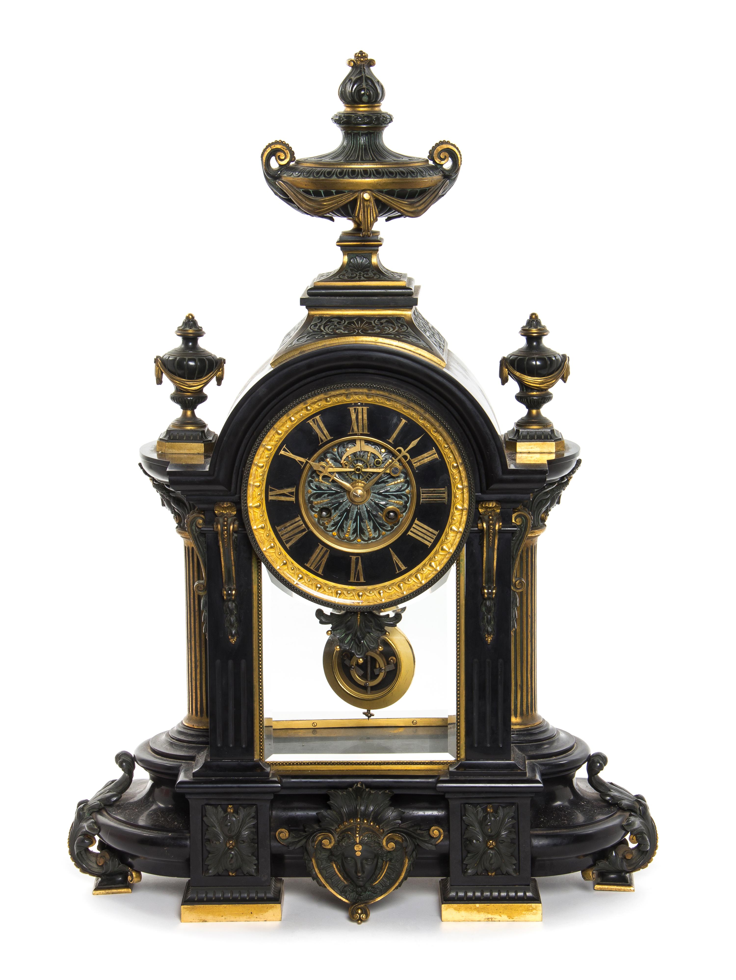 A French Neoclassical Ebonized Bronze and Slate Mantel Clock, Height 27 inches.