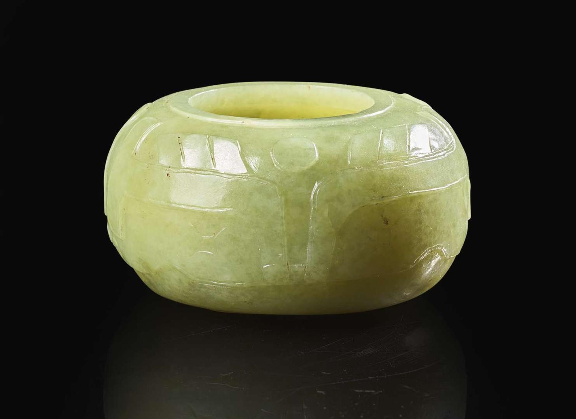 A Chinese carved greenish-yellow jade archaistic coupe Qing dynasty, 18th/19th century 倣古青黃玉水丞 清 十八或十九世紀