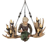 An Austrian Carved Wood and Antler Figural Chandelier