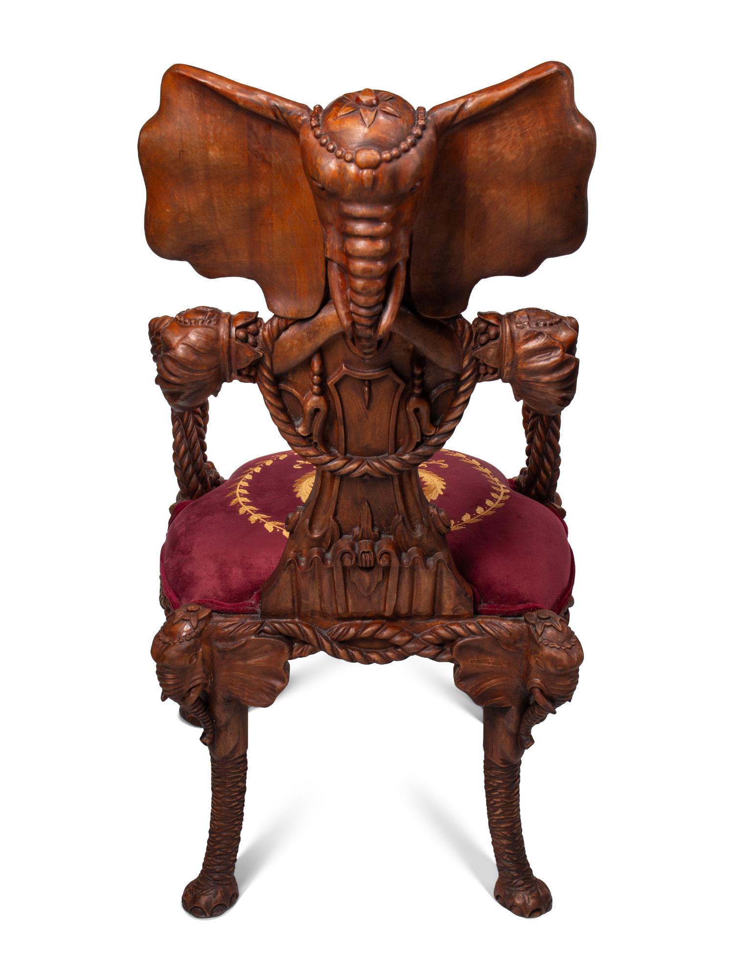 A Set of Four Carved Walnut Elephant Motif Fantasy Chairs