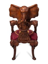 A Set of Four Carved Walnut Elephant Motif Fantasy Chairs