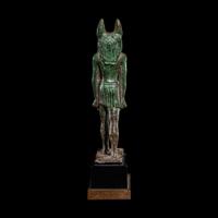 An Egyptian Bronze Striding Anubis