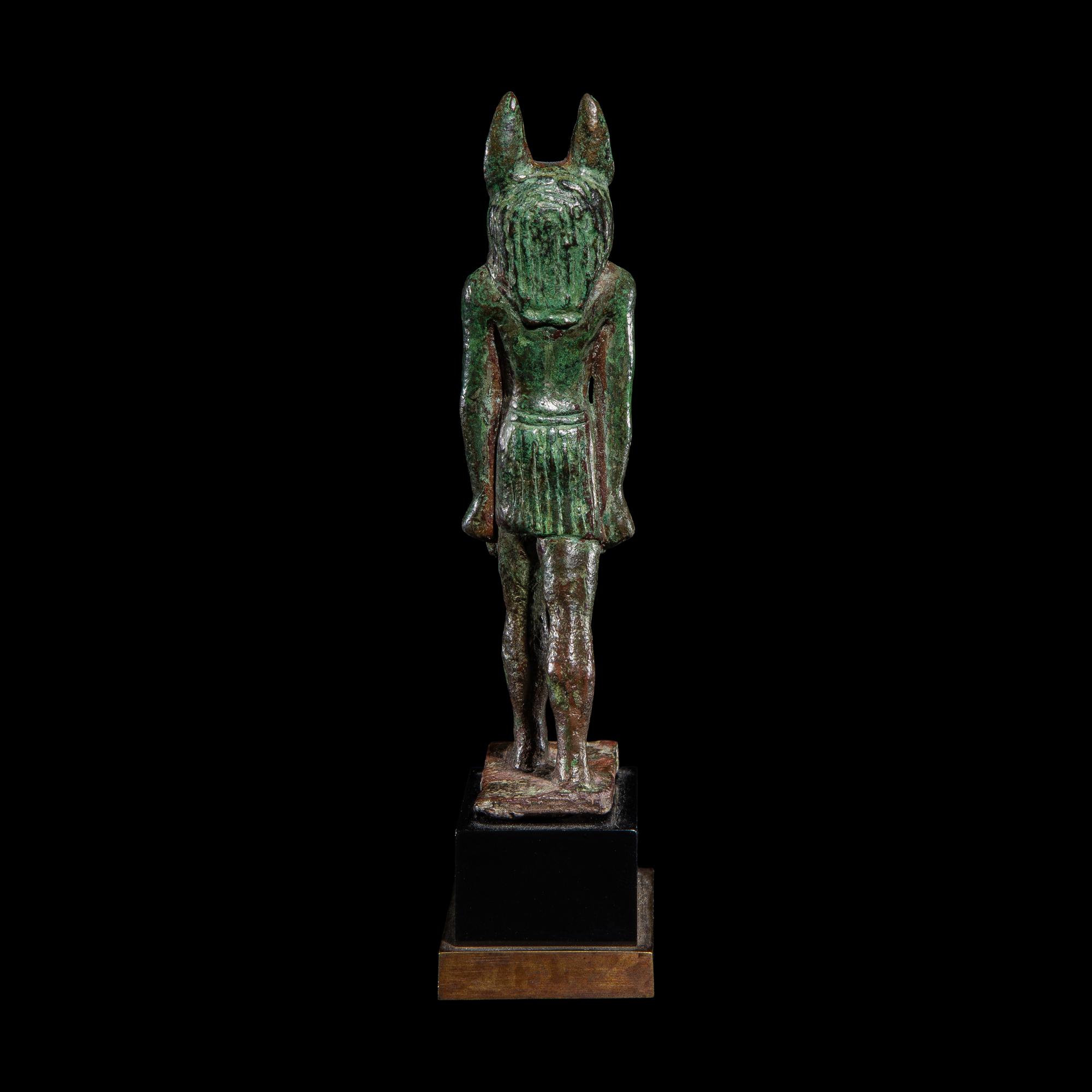 An Egyptian Bronze Striding Anubis