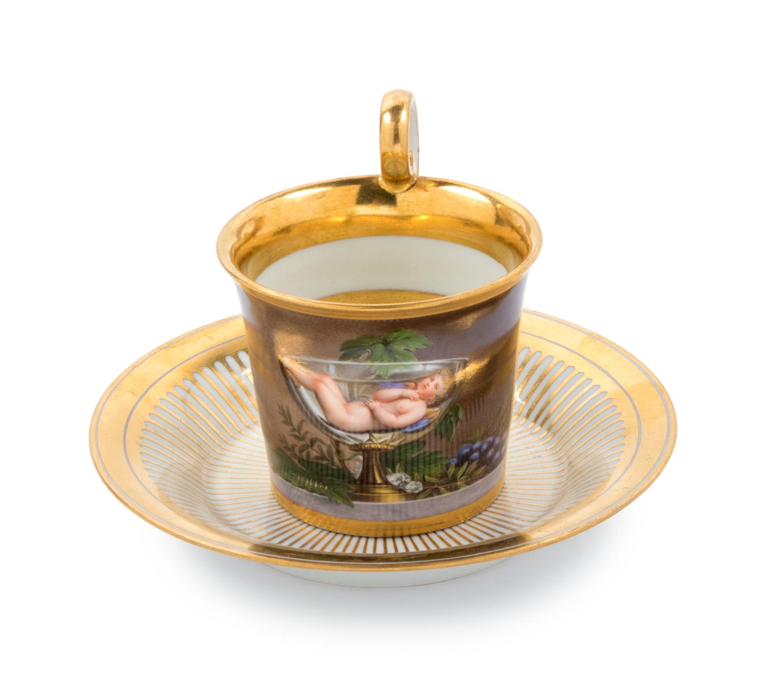 A Vienna Painted and Parcel Gilt Porcelain Teacup and Saucer