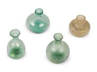 A Group of Four Roman and Islamic Glass Vessels