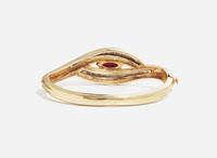 A 14K Yellow Gold and Garnet Bangle Bracelet