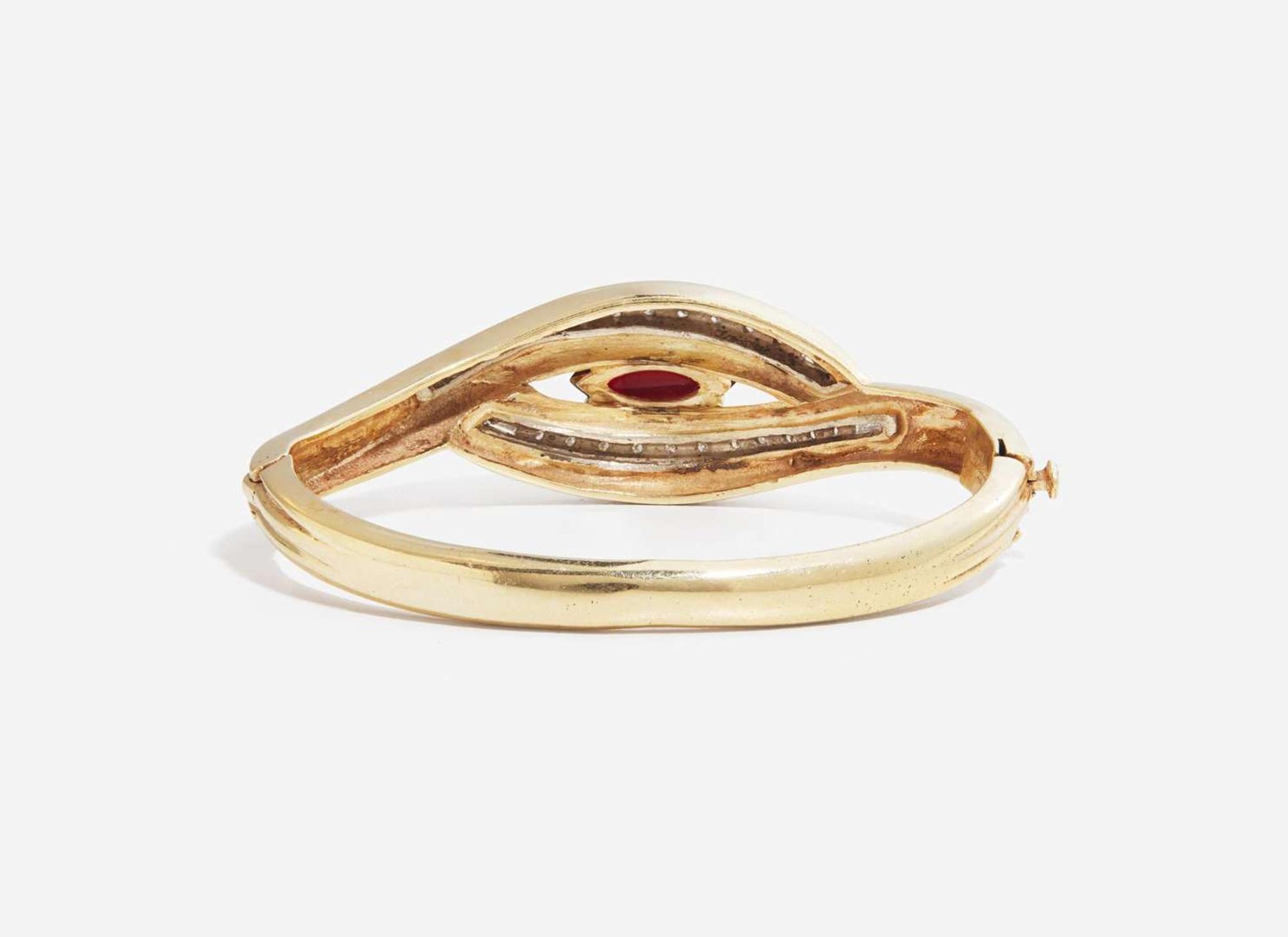 A 14K Yellow Gold and Garnet Bangle Bracelet