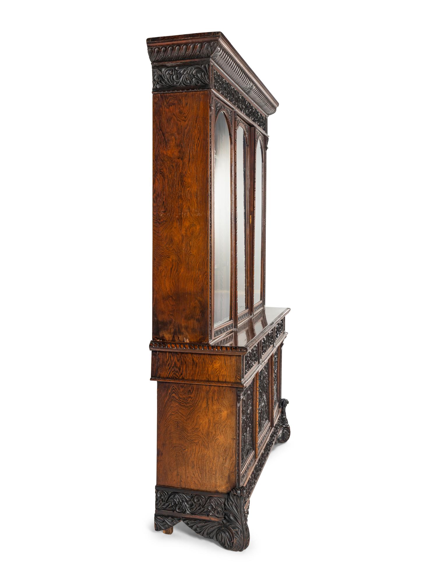 An Italian Rosewood and Carved Walnut Bookcase