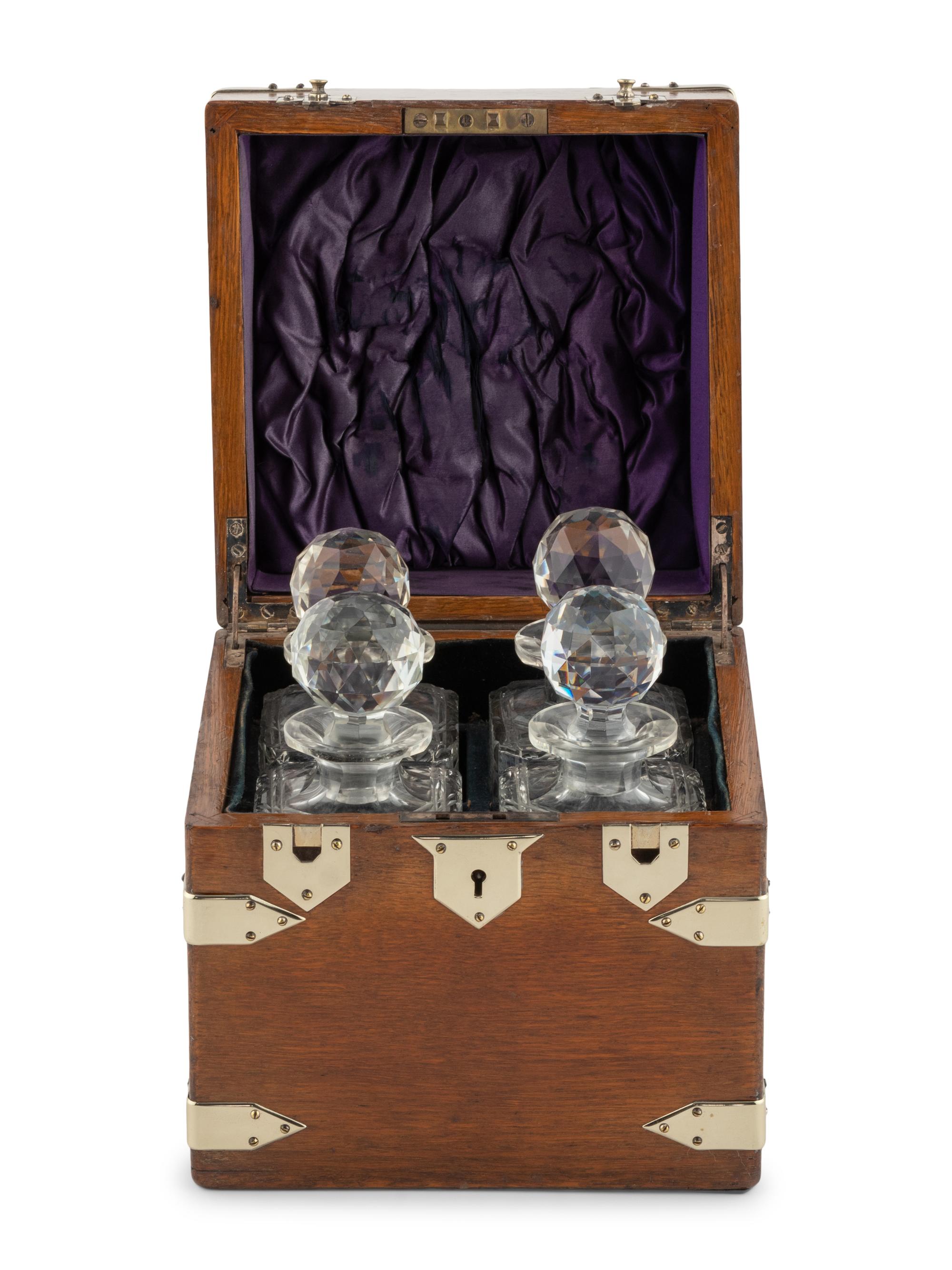 An English Mahogany Cased Four-Bottle Decanter Set