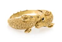 An 18 Karat Yellow Gold and Sapphire Ram's Head Bypass Bangle, J Rossi, 62.90 dwts.