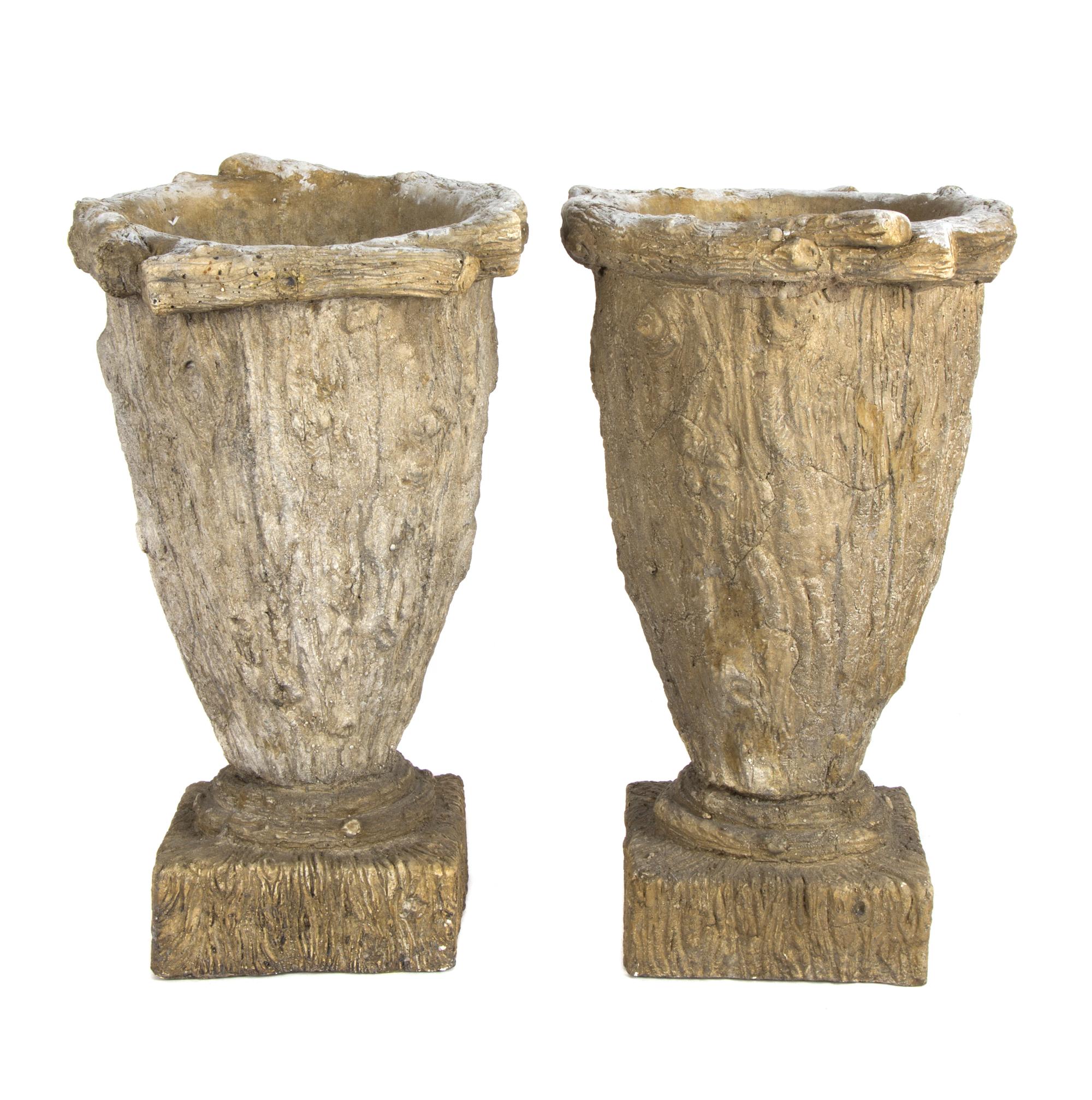 A Pair of Composition Garden Urns Height 16 inches.