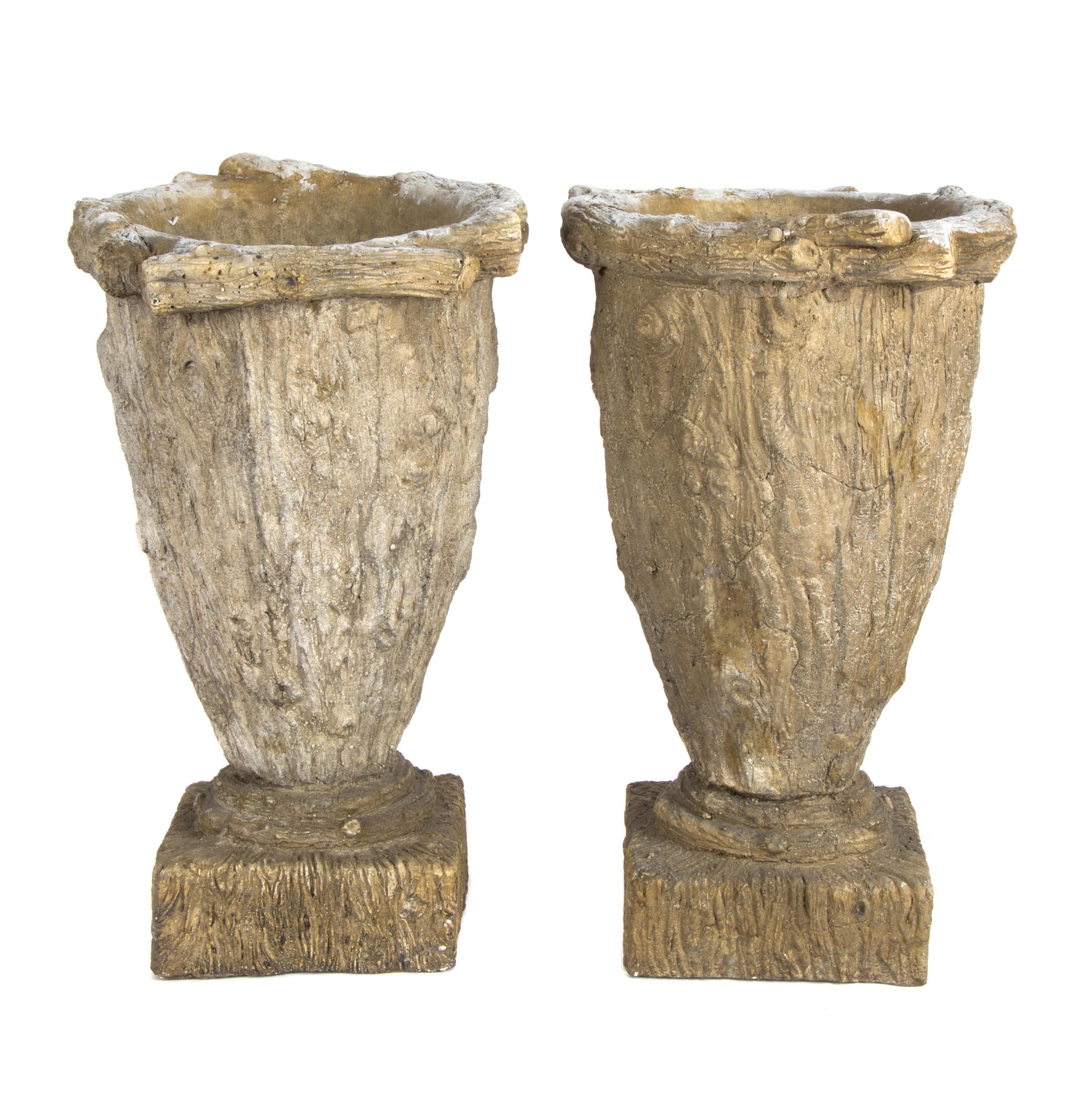 A Pair of Composition Garden Urns Height 16 inches.