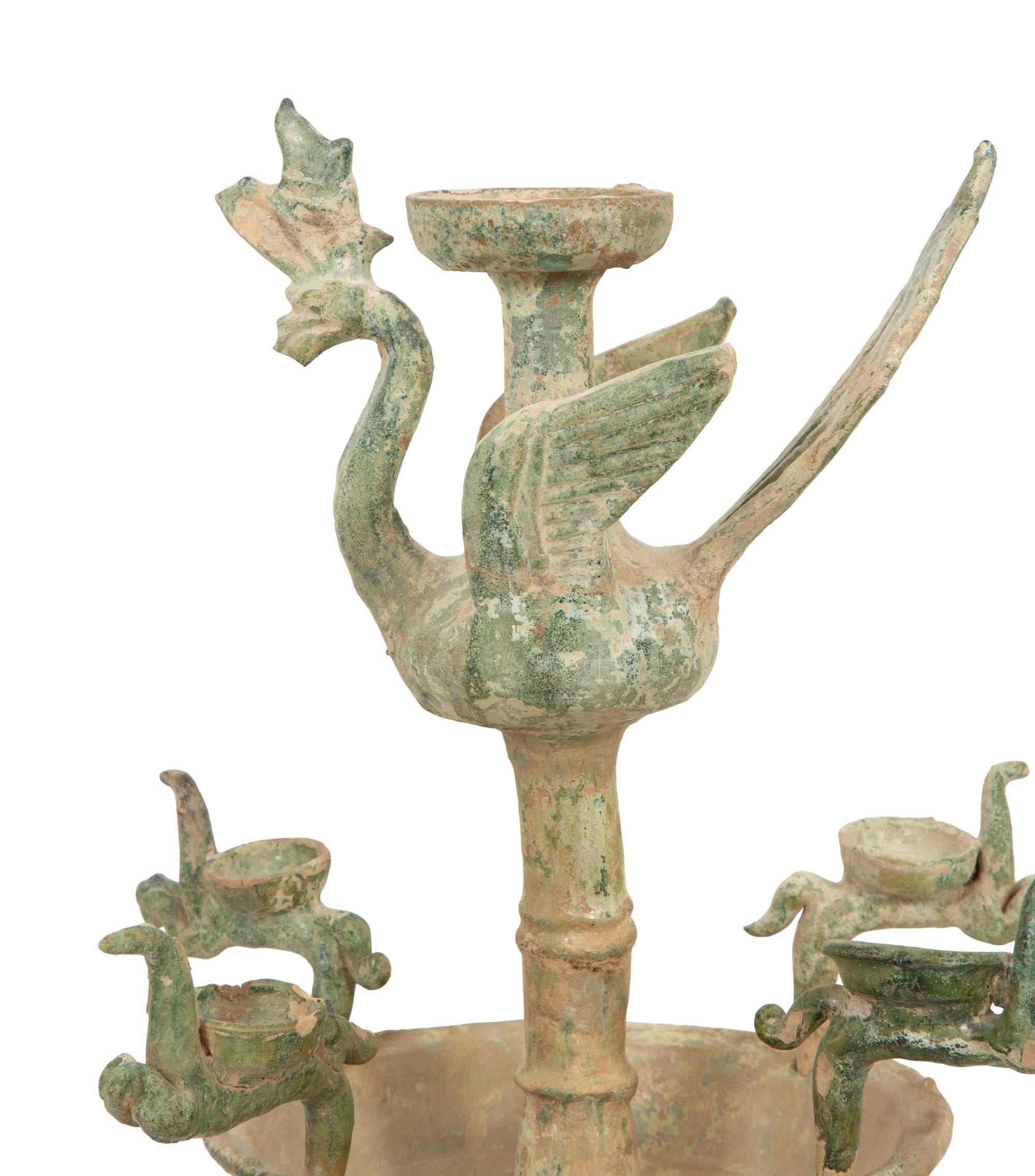 A Han Pottery Phoenix Oil Lamp