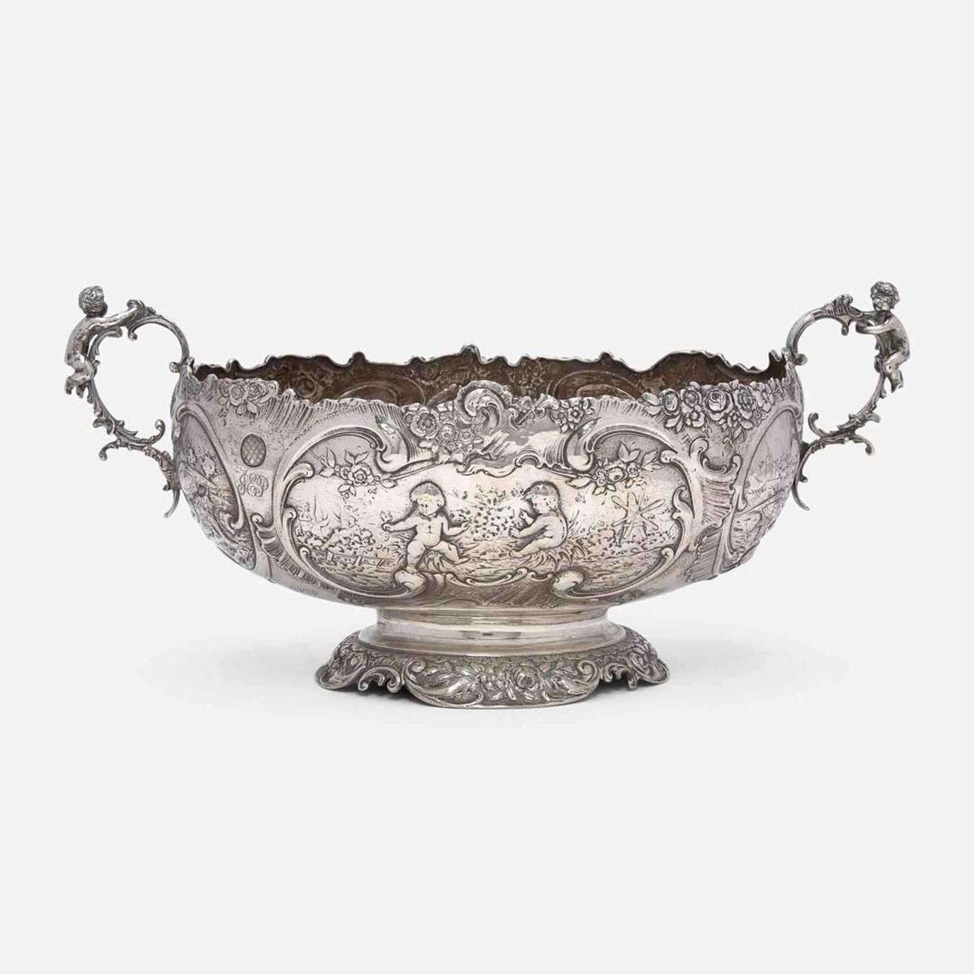 A Continental silver repoussé two-handled centerpeice Likely German, late 19th century