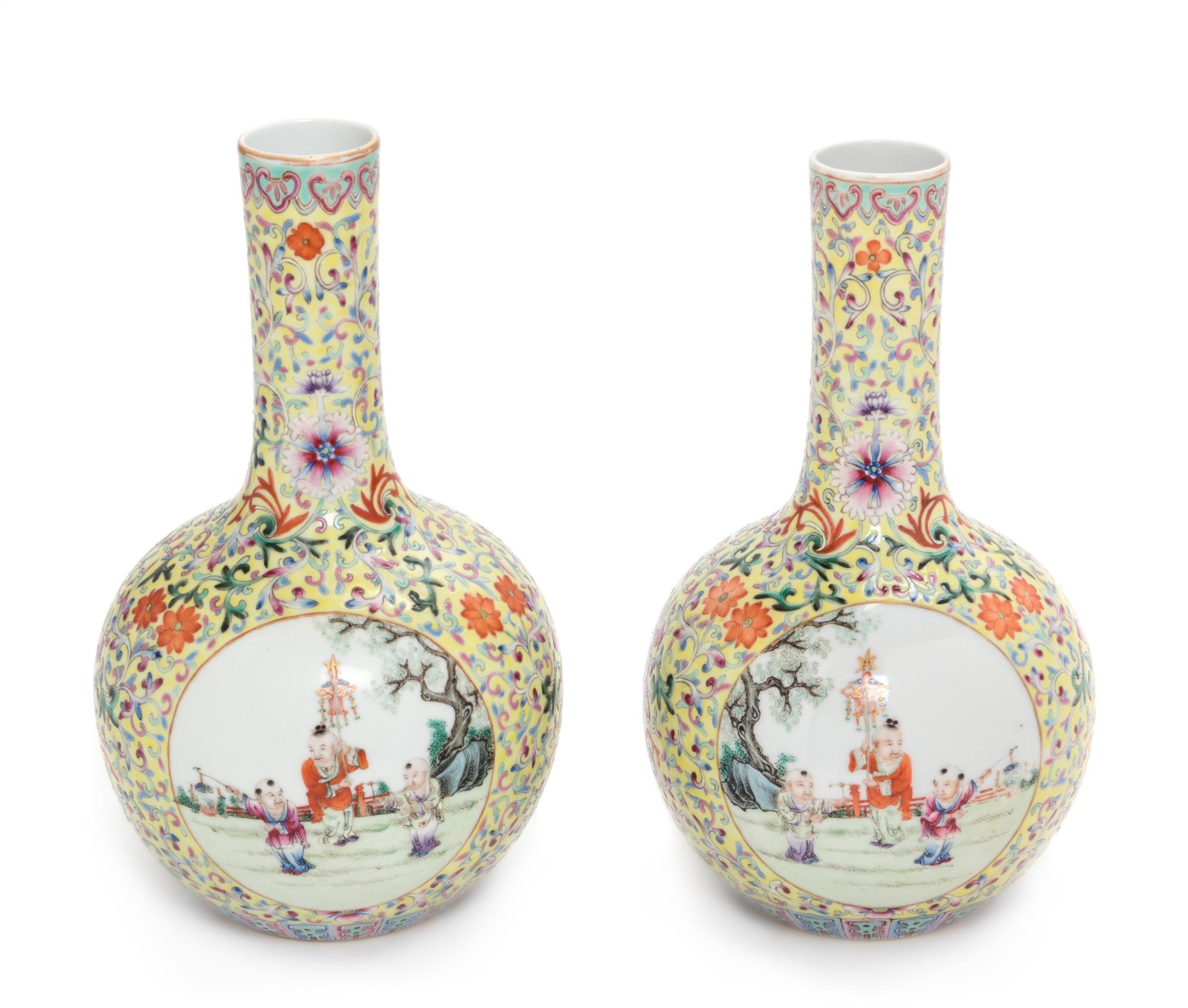 A Pair of Yellow Ground Famille Rose Porcelain Bottle Vases Height of each 9 inches. — LATE 19TH CENTURY