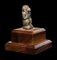 An Egyptian Faience Baboon with Musical Instrument