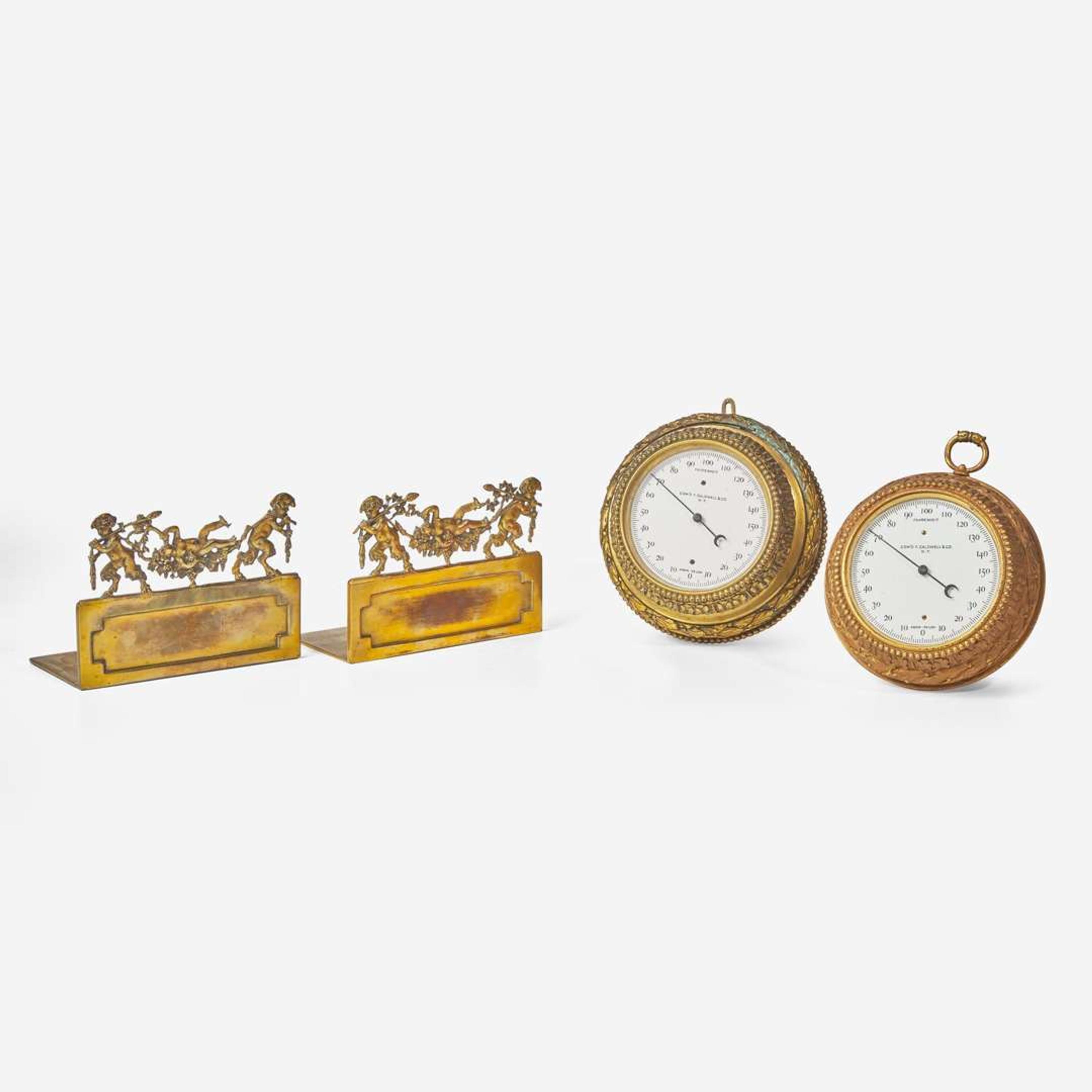 Two gilt bronze wall barometers and pair of gilt bronze bookends Edward F. Caldwell & Co. (active 1895-1959), New York, NY, early 20th century