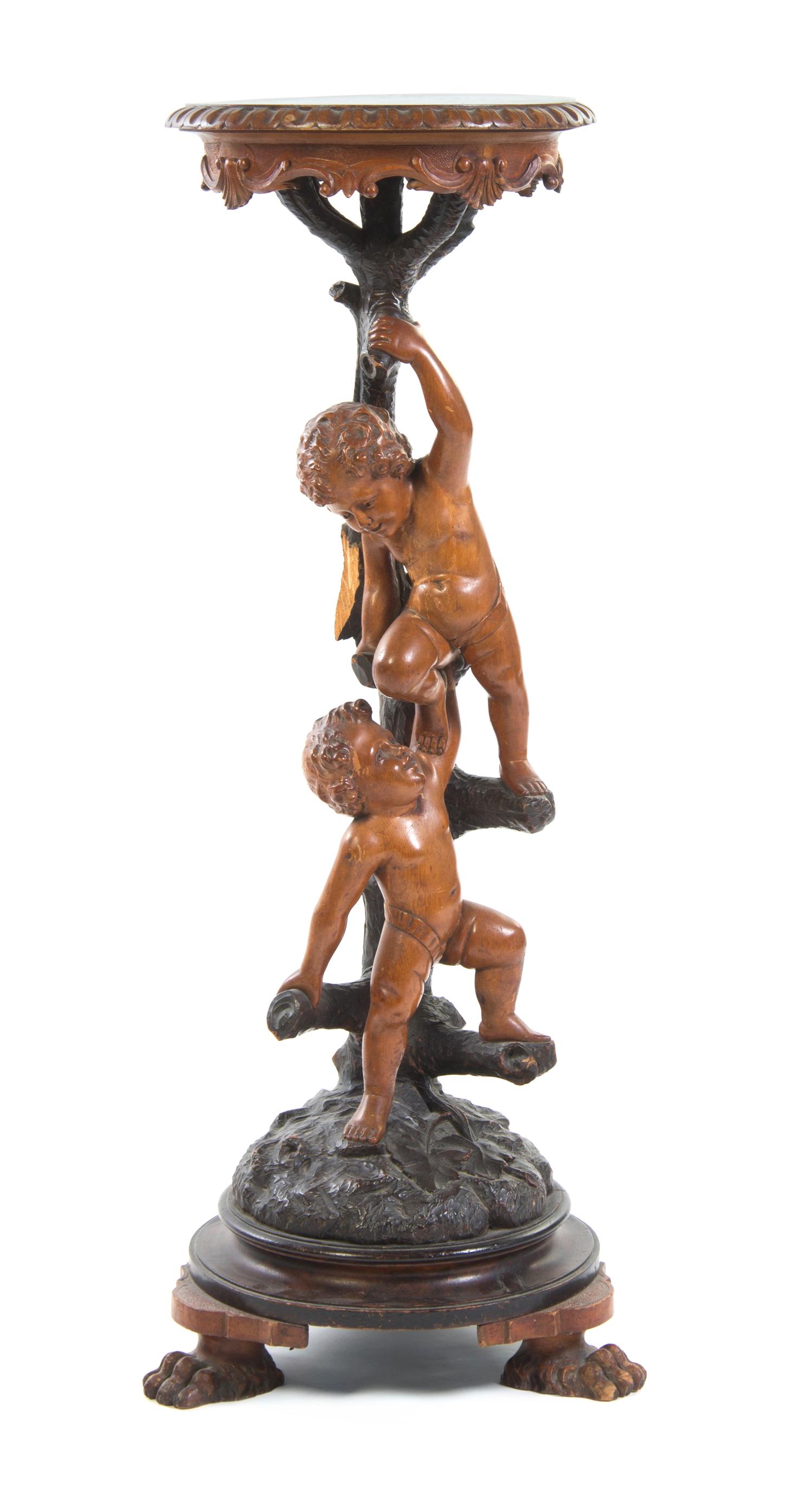 A Continental Carved Figural Pedestal, Height 41 3/4 inches.