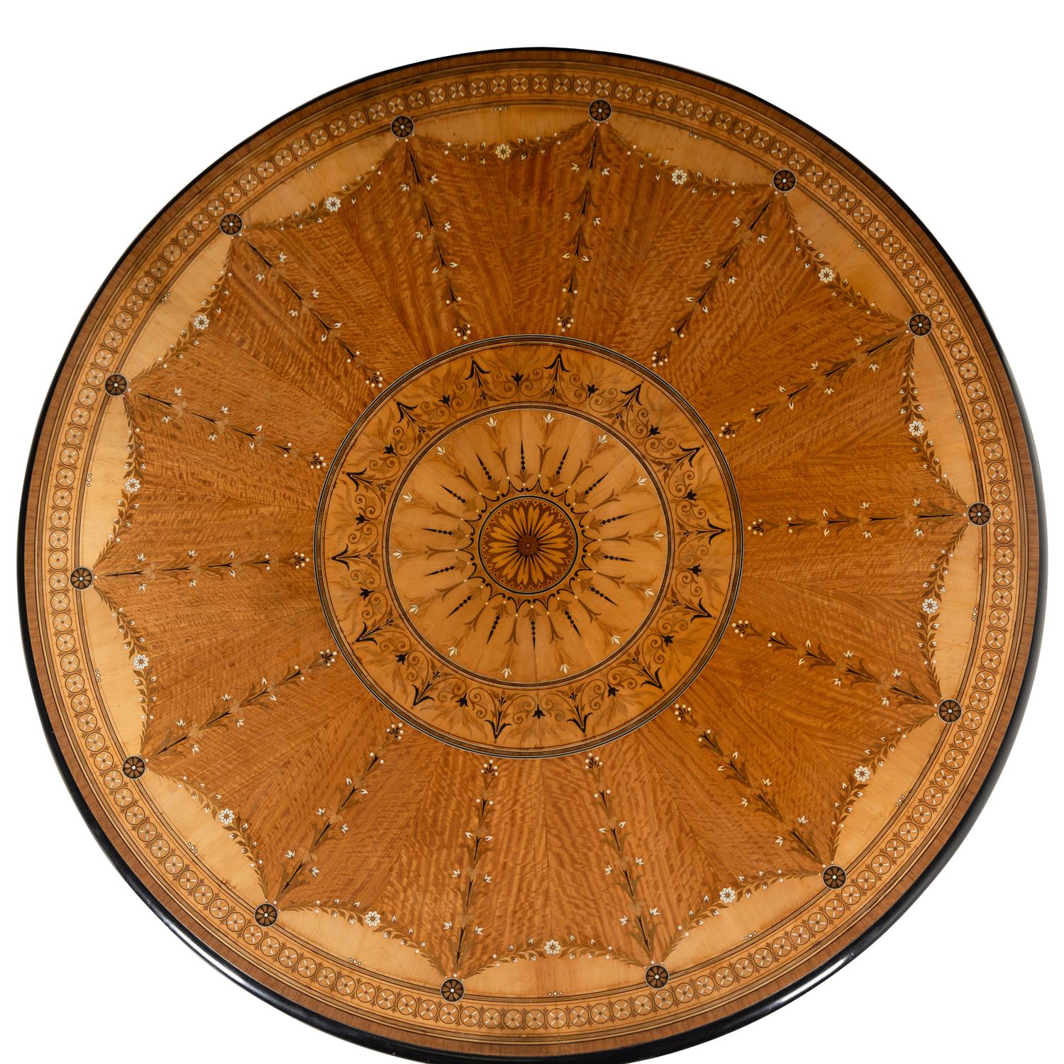 An English Part-Ebonized Satinwood, Harewood and Marquetry Center Table