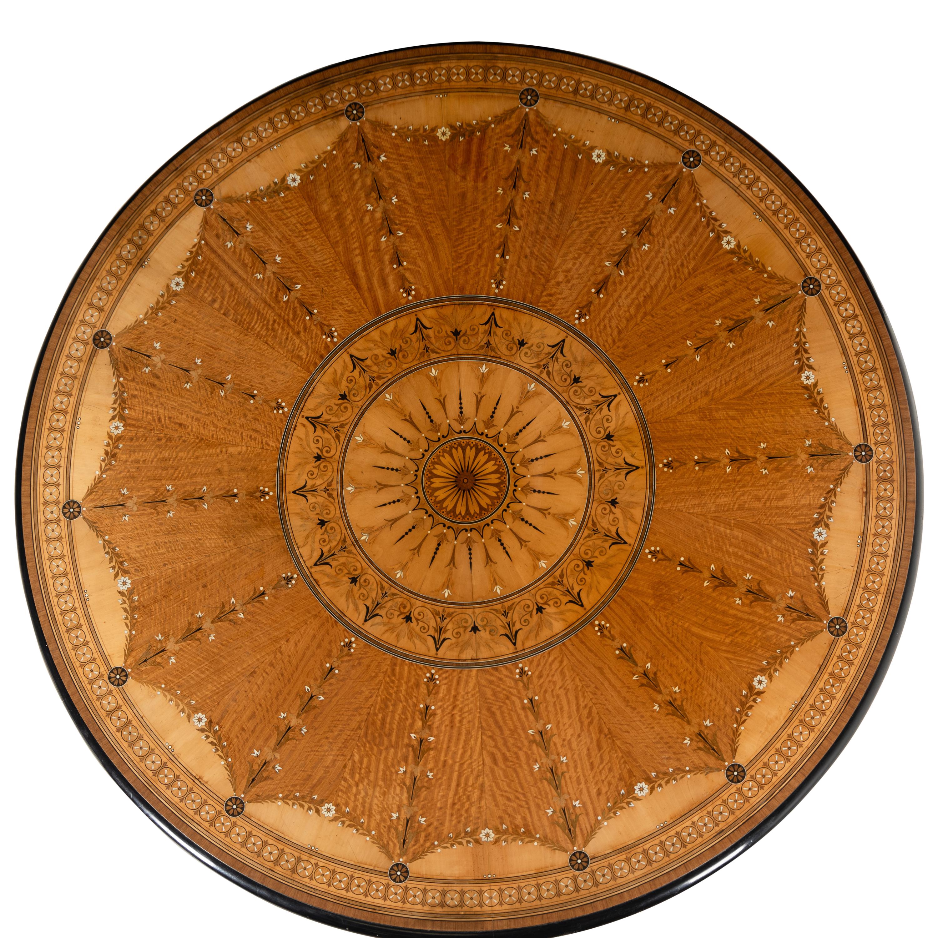 An English Part-Ebonized Satinwood, Harewood and Marquetry Center Table