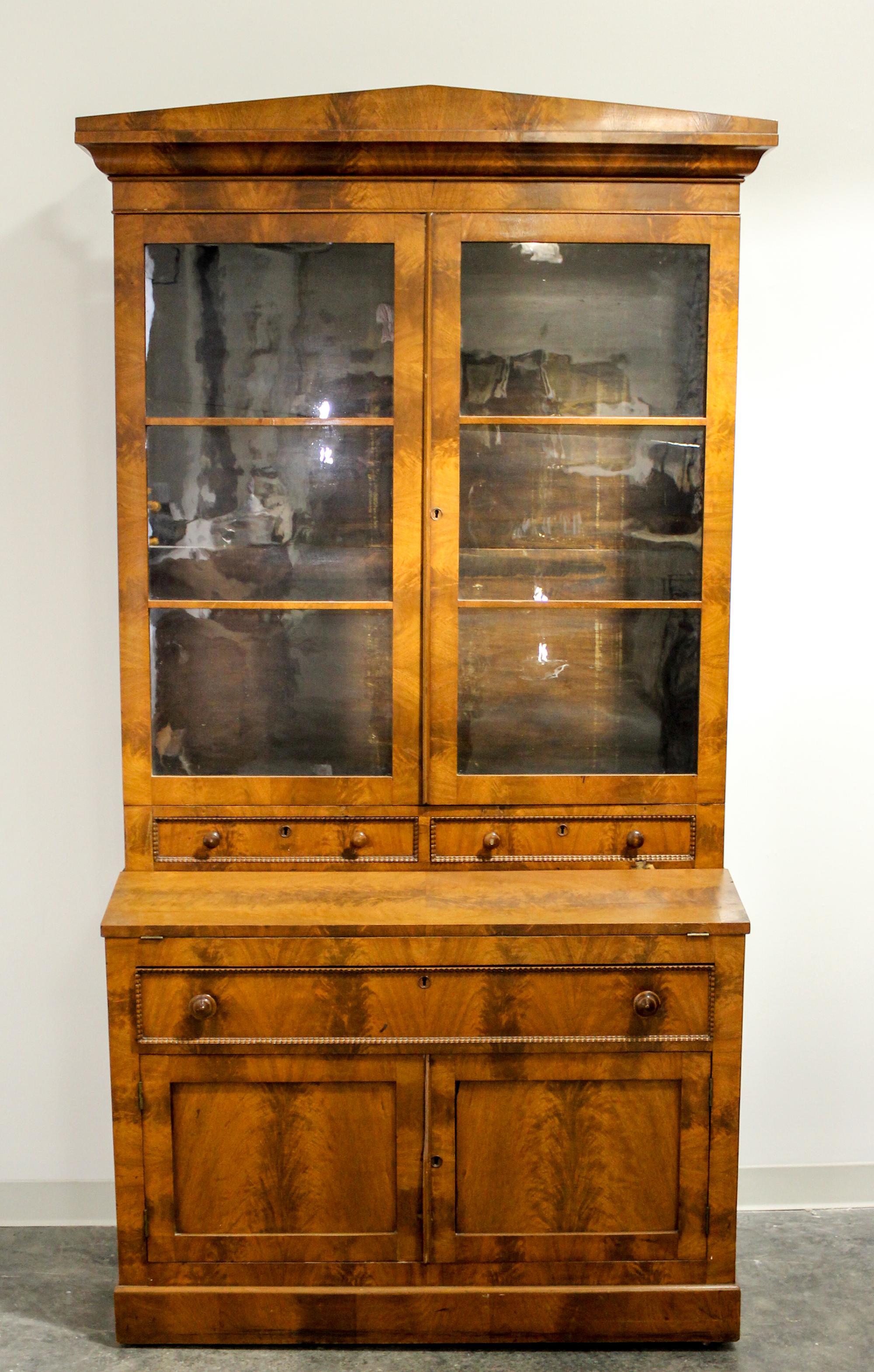 An American Empire Secretary Bookcase Height 90 1/2 x width 41 1/2 x depth 22 inches. — MID 19TH CENTURY
