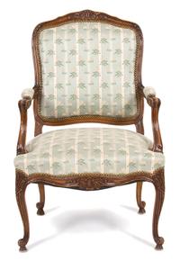 A Louis XV Style Carved Walnut Fauteuil — 19TH CENTURY