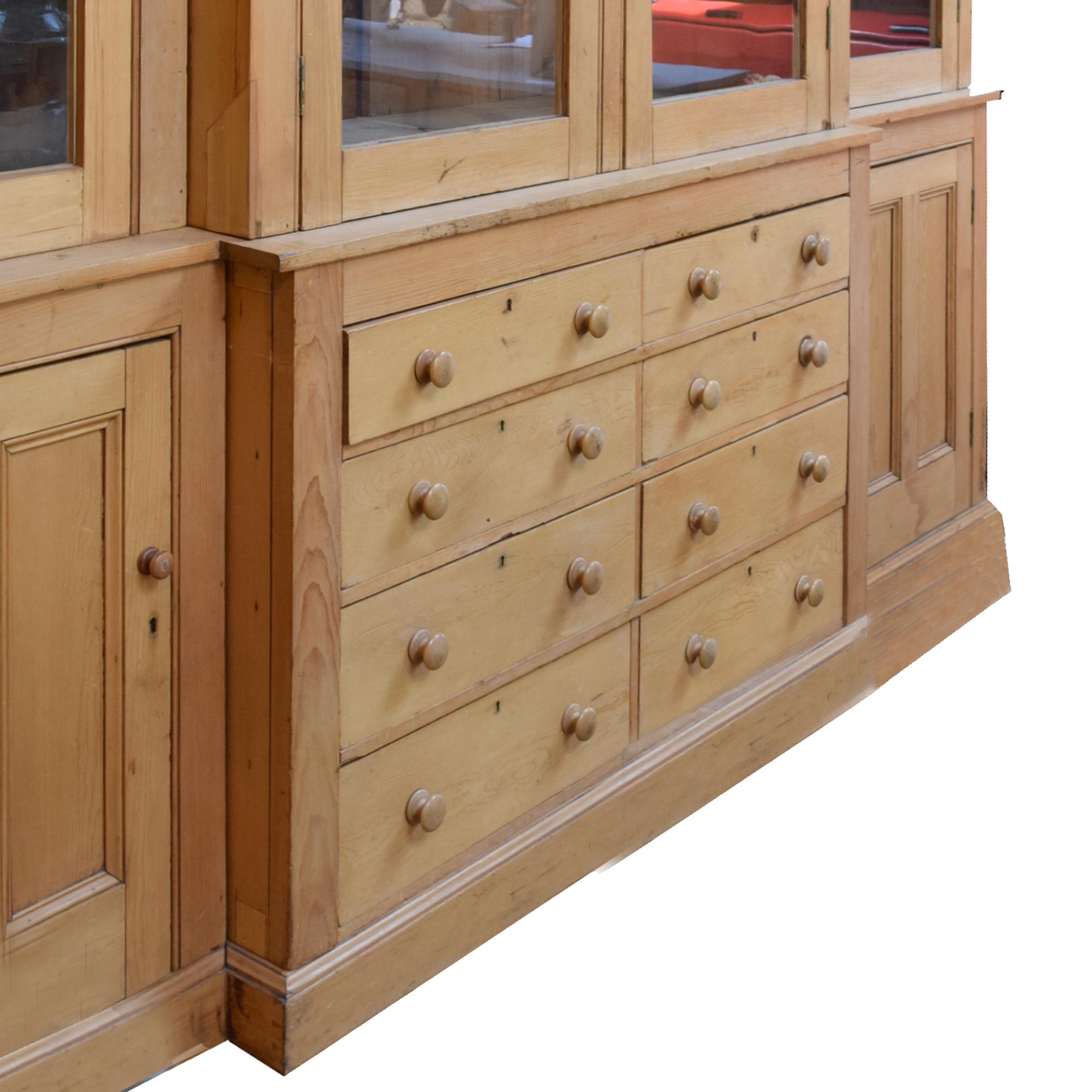 A Pine Breakfront Cabinet 121" W x 24.5" D x 99" H — Englland, 20th Century