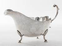An American Silver Sauce Boat, Revere Silversmiths, Brooklyn, NY, 20th Century, Georgian style, of boat form raised on three pad feet,