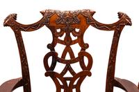 A Set of Sixteen George III Style Carved Walnut Dining Chairs