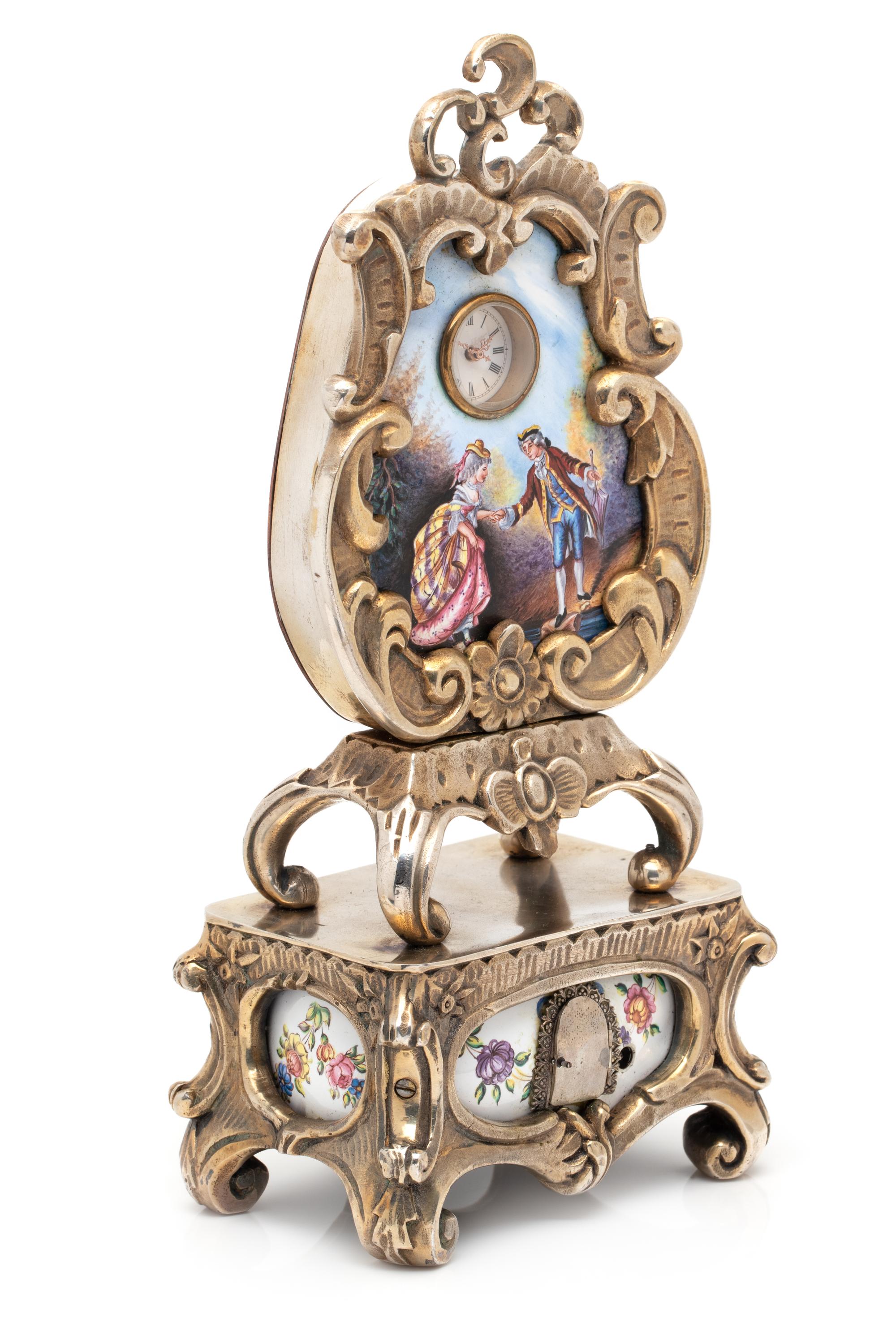 GILT-METAL AND ENAMEL CLOCK WITH HIDDEN AUTOMATON